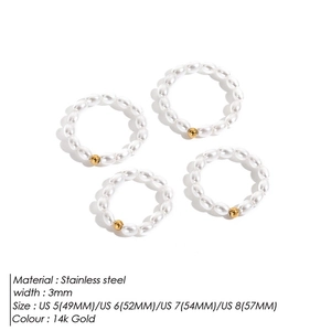 Detail view of 3mm pearl beaded rings in stainless steel with 14k gold finish and sizes
