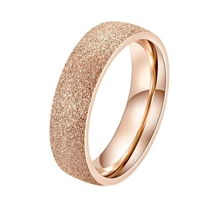Minimalist rose gold titanium ring with a sandblasted matte finish and polished inner band