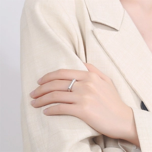 Minimalist geometric square silver ring with polished bar design on model