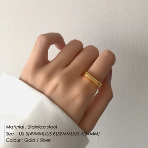 Minimalist gold plated stainless steel square ring shown on hand in sizes 5 to 7