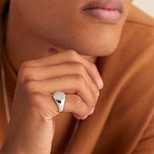 Polished stainless steel oval signet ring for men in a minimalist silver-tone design