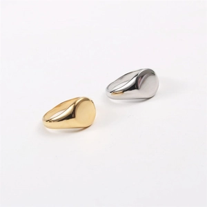 Minimalist oval signet rings in gold and silver finish with polished metal surface