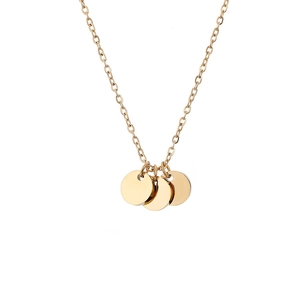 Close-up of three polished 6mm gold round disc pendants on a minimalist steel chain