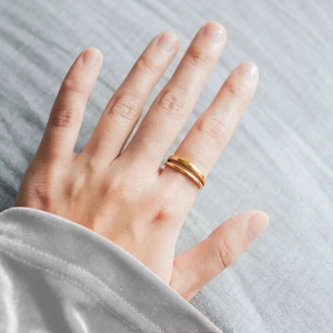 Polished double-layered gold stainless steel open ring shown on finger for women