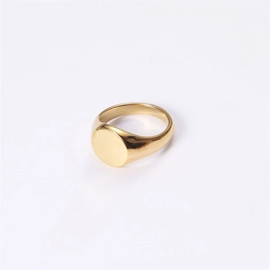 Polished gold round signet ring with smooth circular face and wide minimalist band