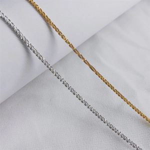Detail of gold and silver stainless steel chain with sparkling glitter texture