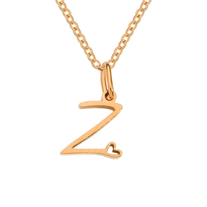 Macro shot of rose gold necklace with a Z letter pendant and a tiny heart detail