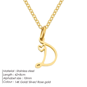 Macro detail of a 10mm golden stainless steel letter D pendant with a small heart element