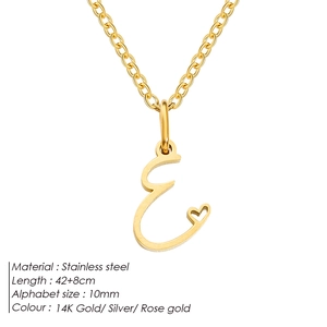 Detail of gold stainless steel necklace with 'E' initial and small heart charm pendant