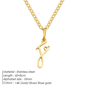 Detailed macro view of gold letter f cursive pendant with heart on stainless steel chain