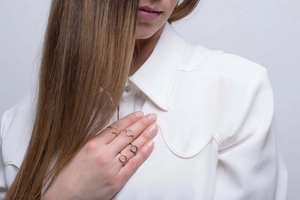 Set of four geometric hollow round rings in gold, silver, rose gold and gunmetal