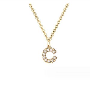 Close-up of 14K gold plated necklace with a sparkling cubic zirconia paved letter C pendant