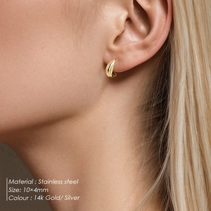 Macro view of 10x4mm 14k gold stainless steel water drop earrings worn by a model