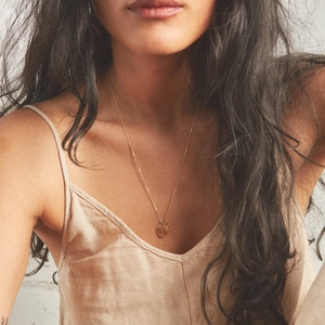 Minimalist gold titanium steel necklace featuring double round pendant on O-chain