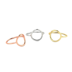 Minimalist hollow circular stainless steel rings in rose gold, silver, and gold finishes