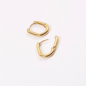 Polished gold U-shaped stainless steel earrings featuring a secure snap closure design