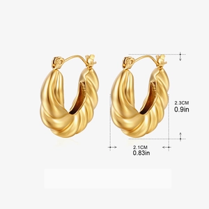 Detail view of twisted gold hoop earrings with dimensions 2.3cm height and 2.1cm width