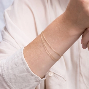 Three-layer gold stainless steel chain bracelet for women featuring minimalist tiered design