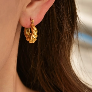 French vintage style gold twisted croissant hoop earrings in polished titanium steel