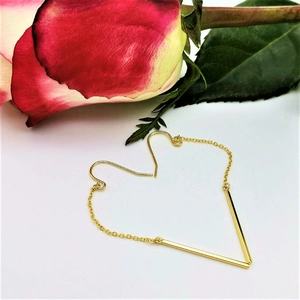 Minimalist gold-plated long chain earrings in a heart shape layout with a fresh rose