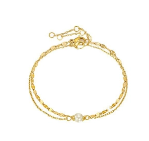 Detail of gold double-layer chain bracelet featuring a white pearl and lobster clasp