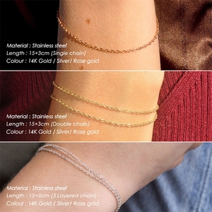 Close-up of gold layered stainless steel chains showing single, double, and triple strands