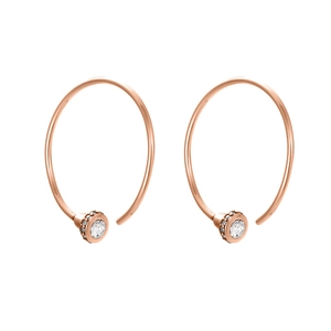 Detail of rose gold hoop earrings featuring a brilliant white zircon stone inlay