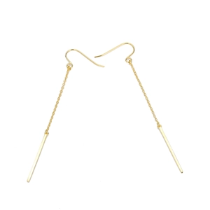 Detail view of long gold chain earrings with minimalist vertical bar pendants on white background