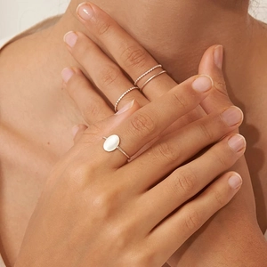 Minimalist silver geometric ring set with oval opal stone and twisted band on model