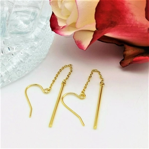 Gold stainless steel long chain drop earrings with heart hook and bar on white background