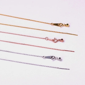 Detailed macro view of adjustable stainless steel chains in gold, rose gold and silver