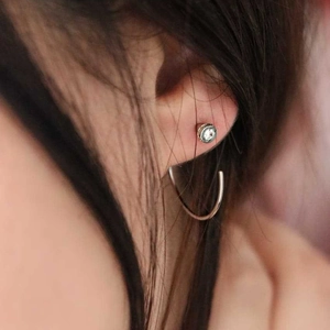 Polished silver stainless steel round hoop earring and zircon stud earring set on model