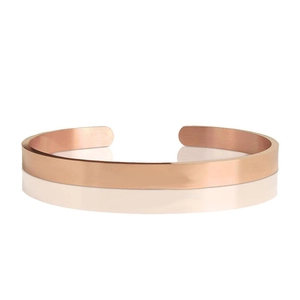 Polished rose gold open bangle bracelet in a sleek minimalist style with metallic texture