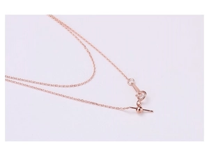 Macro view of adjustable rose gold stainless steel bracelet chain with clasp detail