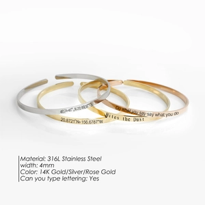 Polished 316L stainless steel open bangle in gold, silver, and rose gold with engraving details