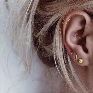 5-piece gold minimalist geometric stud earrings set featuring bar, circle, and triangle designs