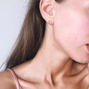 Minimalist silver braided round stud earrings in polished stainless steel for women