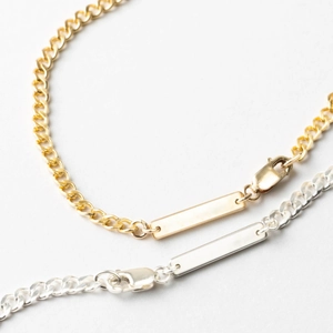 Polished gold and silver stainless steel Cuban link bracelets with rectangular ID tags