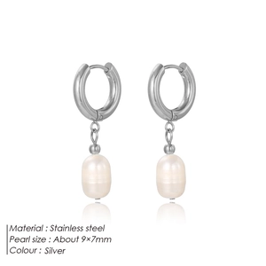 Detail view of silver stainless steel hoop earrings with 9x7mm freshwater pearls