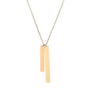 Detail of minimalist gold double vertical bar rectangular pendants on a sleek necklace