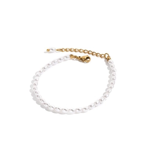 Detail of elegant white pearl bracelet with gold stainless steel lobster clasp and chain