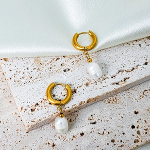 Detailed close-up of 14K gold plated hoop earrings with natural freshwater pearls