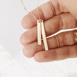 Minimalist gold-plated stainless steel necklace with double vertical bar pendants