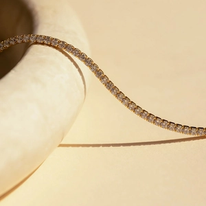 Elegant gold tennis bracelet with brilliant round-cut cubic zirconia in a prong setting