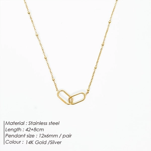 Detailed view of interconnected 14K gold-plated oval links on a dainty beaded chain