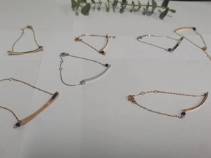 Detailed set of six minimalist bar bracelets with beads in gold, silver, and rose gold