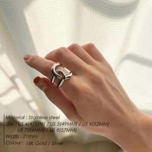 Interlocked silver stainless steel ring for women with double-loop design on model hand