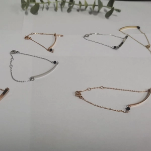 Minimalist stainless steel bar bracelets in rose gold and silver with black bead accents