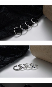 Macro detail of S925 sterling silver rings with lava texture and colored zircon stones