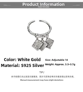 Detail view of S925 silver open ring with three textured square charms in white gold finish